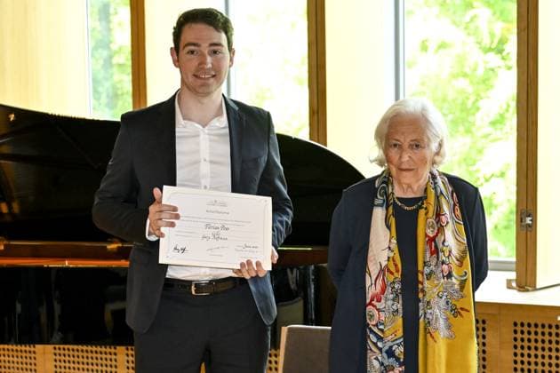 Florian Pons and Queen Paola of Belgium pictured during the Academic Closing Ceremony at the Queen Elisabeth Music chapel, in Waterloo, Friday 02 June 2023. The Queen will present the Artists in Residence at the Queen Elisabeth Music Chapel with their Artist Diploma, marking the end of their residency at the Queen Elisabeth Music Chapel.  DIRKxWAEM 68311483