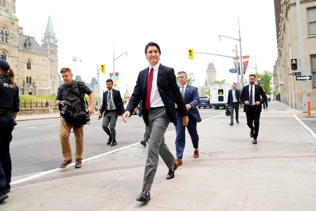 June 5, 2023, Ottawa, ON, CANADA: Prime Minister Justin Trudeau is flanked by security as he crosses the road on his way to a press conference, in Ottawa, Monday, June 5, 2023. Ottawa CANADA  - ZUMAc35_ 20230605_zaf_c35_012 Copyright: xSeanxKilpatrickx