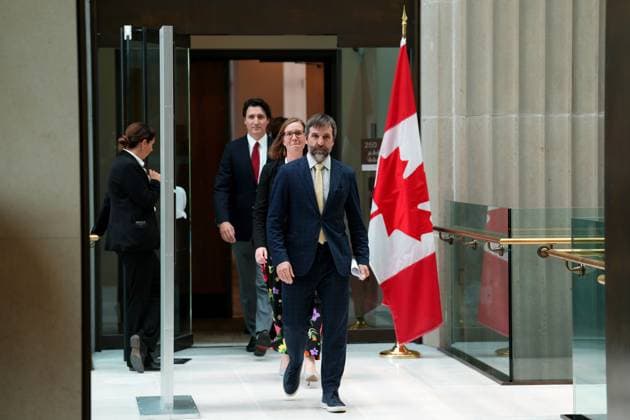 June 5, 2023, Ottawa, ON, CANADA: Prime Minister Justin Trudeau is led to a press conference by Environment Minister Steven Guilbeault and Social Development Minister Karina Gould, in Ottawa, Monday, June 5, 2023. Ottawa CANADA  - ZUMAc35_ 20230605_zaf_c35_021 Copyright: xSeanxKilpatrickx