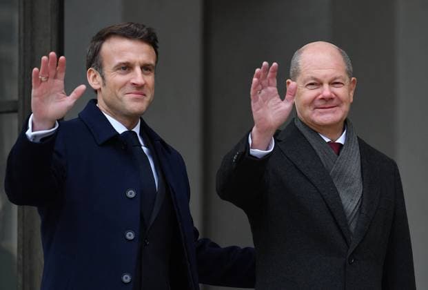 Emmanuel Macron Olaf Scholz At The Elysee Palace - Paris France s President Emmanuel Macron and German Chancellor Olaf Scholz arrive to attend a cabinet meeting, as part of the celebration of the 60th anniversary of the signing of the Elysee Treaty, to seal reconciliation between France and West Germany, 18 years after the Second World War at the presidential Elysee Palace in Paris on January 22, 2023. The date of the reunion is highly symbolic: sixty years to the day after Charles de Gaulle and Konrad Adenauer signed the Elysee Treaty, which marked the end of decades, if not centuries, of fierce rivalries and bloody wars , write the two leaders in an op-ed published by the German daily Frankfurter Allgemeine Zeitung and the French Journal  Copyright: xLiewigxChristian ABACAx 839306_018 LiewigxChristian ABACAx 839306_018