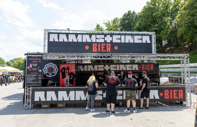 Fans at beer stand beer stand alcohol drinks Rammsteiner beer at Rammstein concert by Till Lindemann at Olympiapark in Munich Germany date 07 06 2023