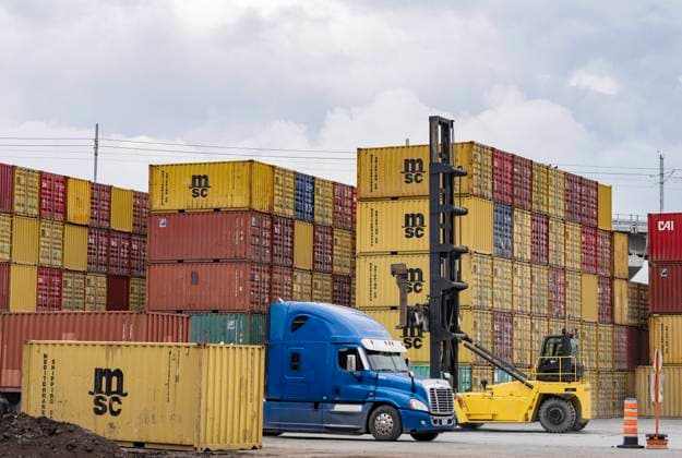 June 9, 2023, MONTREAL, PQ, CANADA: Shipping container are off-loaded at a transloading and container storage facility in Montreal, Friday, June 9, 2023. MONTREAL CANADA  - ZUMAc35_ 20230609_zaf_c35_082 Copyright: xChristinnexMuschix