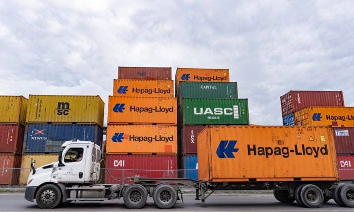 June 9, 2023, MONTREAL, PQ, CANADA: A truck carrying a shipping container drives past a transloading and container storage facility in Montreal, Friday, June 9, 2023. MONTREAL CANADA  - ZUMAc35_ 20230609_zaf_c35_087 Copyright: xChristinnexMuschix
