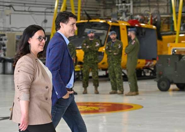 June 14, 2023, SAGUENAY, PQ, Canada: Prime Minister Justin Trudeau and Saguenay Mayor Julie Dufour walk to a news conference, Wednesday, June 14, 2023 at CFB Bagotville in Saguenay, Que. Trudeau came to meet soldiers who worked on battling wildfires. SAGUENAY Canada  - ZUMAc35_ 20230614_zaf_c35_023 Copyright: xJacquesxBoissinotx