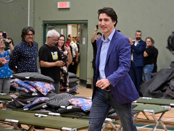 June 14, 2023, SAGUENAY, PQ, Canada: Prime Minister Justin Trudeau walks in a gymnasium where Indigenous people of Ouje-Bougoumou who were evacuated because of wildfires are staying, Wednesday, June 14, 2023 at Chicoutimi Cegep in Saguenay, Que. SAGUENAY Canada  - ZUMAc35_ 20230614_zaf_c35_024 Copyright: xJacquesxBoissinotx