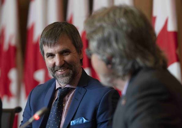 June 14, 2023, Ottawa, ON, Canada: Minister of Environment and Climate Change Steven Guilbeault smiles as Senator Stan Kutcher speaks during a news conference, in Ottawa, Wednesday, June 14, 2023. Ottawa Canada  - ZUMAc35_ 20230614_zaf_c35_021 Copyright: xAdrianxWyldx