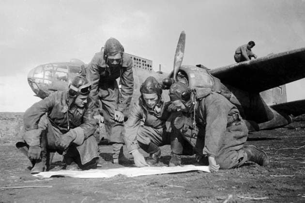 PLANE CREW COMBAT TASK 966 13.08.1943 The crew under Lieutenant I. Komainets command discussing a combat task. The Kharkov region, Ukraine. Olga Lander Sputnik Kharkiv region Ukraine  Copyright: xOlgaxLanderx