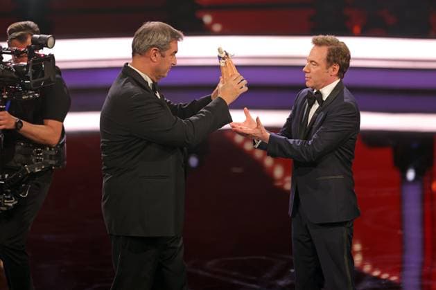 Markus Söder and Michael Bully Herbig award ceremony Bavarian Film Award 2022 Bavarian Prime Minister Dr Markus Söder li presents Michael Bully Herbig with the honorary award award ceremony of the 44 Bavarian Film Award 2022 on 16 06 2023 in Munich Prinzregententheater Munich, Bavaria, Germany