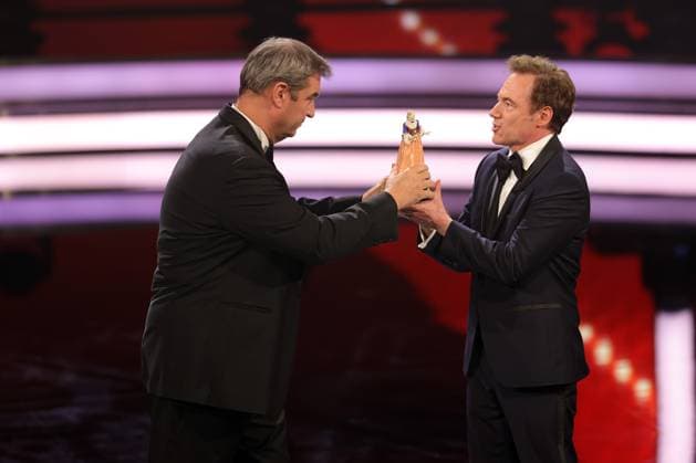 Markus Söder and Michael Bully Herbig award ceremony Bavarian Film Award 2022 Bavarian Prime Minister Dr Markus Söder li presents Michael Bully Herbig with the honorary award award ceremony of the 44 Bavarian Film Award 2022 on 16 06 2023 in Munich Prinzregententheater Munich, Bavaria, Germany