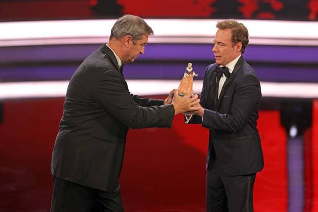 Markus Söder and Michael Bully Herbig award ceremony Bavarian Film Award 2022 Bavarian Prime Minister Dr Markus Söder li presents Michael Bully Herbig with the honorary award award ceremony of the 44 Bavarian Film Award 2022 on 16 06 2023 in Munich Prinzregententheater Munich, Bavaria, Germany