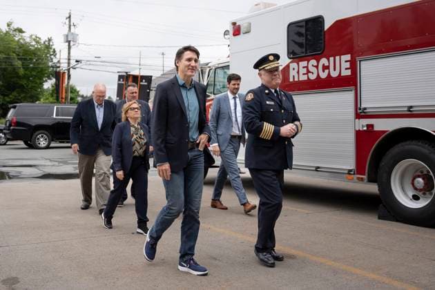 June 19, 2023, Hammonds Plains, NS, Canada: Prime Minister Justin Trudeau, centre, walks with Ken Stuebing, right, Halifax Regional Fire and Emergency chief, before meeting with firefighters who battled the wildfires in Nova Scotia while visiting Fire Station 50 in Hammonds Plains, N.S. on Monday, June 19, 2023. Hammonds Plains Canada - ZUMAc35_ 20230619_zaf_c35_015 Copyright: xDarrenxCalabresex