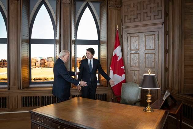 June 19, 2023, Antigonish, NS, Canada: Prime Minister Justin Trudeau, right, is offered a seat at the desk by former prime minister Brian Mulroney while touring a replica of Mr. Mulroney s former parliamentary office in Mulroney Hall at St. Francis Xavier University in Antigonish, N.S. on Monday, June 19, 2023. Antigonish Canada  - ZUMAc35_ 20230619_zaf_c35_070 Copyright: xDarrenxCalabresex