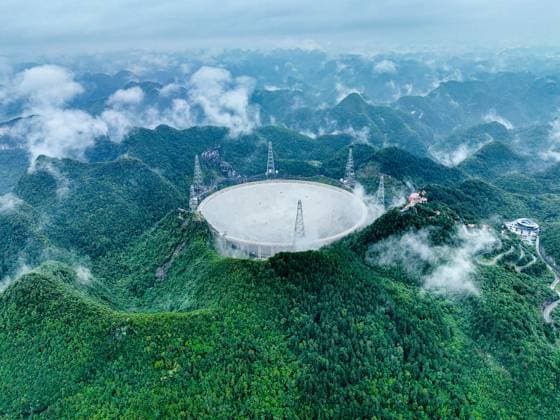 Creative Highlights World (230623) -- PINGTANG, June 23, 2023 -- This aerial photo taken on June 22, 2023 shows China s Five-hundred-meter Aperture Spherical Radio Telescope (FAST) under maintenance in southwest China s Guizhou Province. China s FAST telescope identified a binary pulsar with an orbital period of 53.3 minutes, the shortest known period for a pulsar binary system. The research, mainly conducted by a team led by scientists from the National Astronomical Observatories of the Chinese Academy of Sciences (NAOC), was published in the journal Nature Wednesday. ) (EyesonSci)CHINA-GUIZHOU-FAST-TELESCOPE-BINARY PULSAR-DETECTION (CN) OuxDongqu 