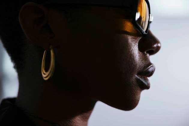 Young woman wearing sunglasses against white background model released, Symbolfoto property released, EBSF03533