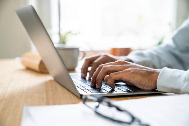 Hands of freelancer typing on laptop at home model released, Symbolfoto property released, VPIF08160