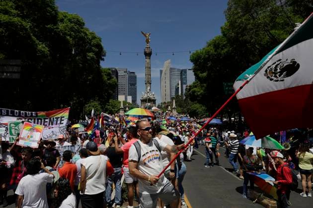 LGBTTTIQA Pride March In Mexico City A person holds a Mexican flag on Paseo de la Refroma in Mexico City, on the occasion of the LGBTTTIQA Pride March in Mexico. Mexico City Mexico City Mexico  Copyright: xGerardoxVieyrax originalFilename: vieyra-notitle230624_nprGt.jpg