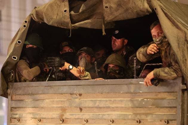 RUSSIA, ROSTOV-ON-DON - JUNE 24, 2023: PMC Wagner fighters are seen on a military truck. Erik Romanenko TASS  60051588