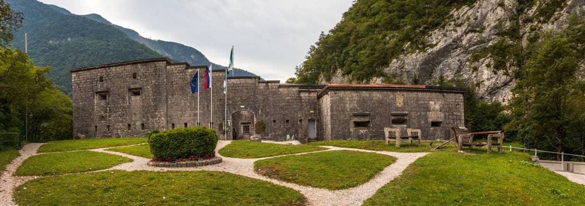 Entrance Panorama of Fortress, Fort Kluze, german: Flitscher Klause. Fortification for World War during Isonzo Front. Bovec, Gorizia, Slovenia. In the 15th century, the Klu?e Fort was a wooden fortification, intended to prevent the Turkish invasions to Koro?ka. Later on, a stone fortification was built, which was defended by Austrian soldiers from the military of general Napoleon Bonaparte in the 18th century. The fort obtained its modern view in the 19th century, while in the 20th century it played an important role on the Isonzo Front. Copyright: xZoonar.com unununiusx 14323721