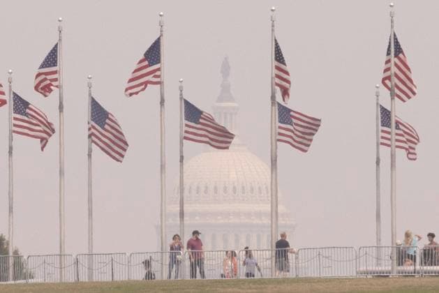 (230629) -- WASHINGTON, June 29, 2023 -- People are seen with the U.S. Capitol building shrouded in haze in the background in Washington, D.C., the United States, on June 29, 2023. Over 120 million people across more than a dozen U.S. states from the Midwest to the East Coast are under air quality alerts as of Thursday, as smoke from Canadian wildfires continues to sweep across the country. (Photo by Xinhua) U.S.-WASHINGTON, D.C.-AIR POLLUTION AaronxSchwartz 