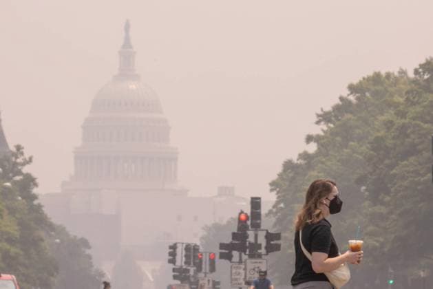 (230629) -- WASHINGTON, June 29, 2023 -- A pedestrian wearing a face mask is seen with the U.S. Capitol building shrouded in haze in the background in Washington, D.C., the United States, on June 29, 2023. Over 120 million people across more than a dozen U.S. states from the Midwest to the East Coast are under air quality alerts as of Thursday, as smoke from Canadian wildfires continues to sweep across the country. (Photo by Xinhua) U.S.-WASHINGTON, D.C.-AIR POLLUTION AaronxSchwartz 