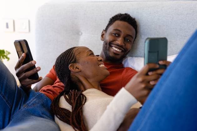 Happy african american couple using smartphones lying on bed in bedroom Happy african american couple using smartphones lying on bed in bedroom. Relaxation, lifestyle, relationship, togetherness, communication and domestic life, unaltered., model released, , property released, Cape Town, South Africa, 2023-03-01T22:00:00.000Z, 4075959.jpg, people,happy,african american,couple,using,smartphones,lying,bed,bedroom,relaxation,lifestyle,relationship,togetherness,communication,domestic life,unaltered,young,together,adult,person,happiness,leisure,smiling,smile,love,cheerful,attractive,family,internet,fun,home,portrait,relax,casual,sitting,african,american,domestic,life Young Adult,Man,Male,Black,Woman,Female