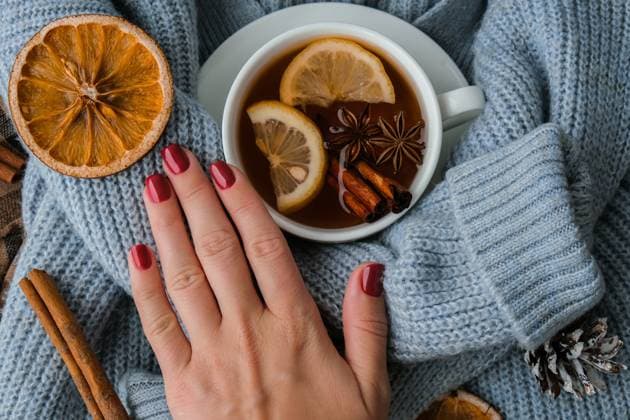 Blue sweater and cup of hot tea with lemon cinnamon sticks and anise star. Dry slices of citrus orange and cones. Hot winter cocktail. Christmas, Thanksgiving drinks. Autumn, grog, hot sangria, mulled wine Blue sweater and cup of hot tea with lemon cinnamon sticks and anise star. Dry slices of citrus orange and cones. Hot winter cocktail. Christmas, Thanksgiving drinks. Autumn, grog, hot sangria, mulled wine. Festive holiday flat lay atmosphere Copyright: xZoonar.com AnastasiiaxYanishevskax 17841898