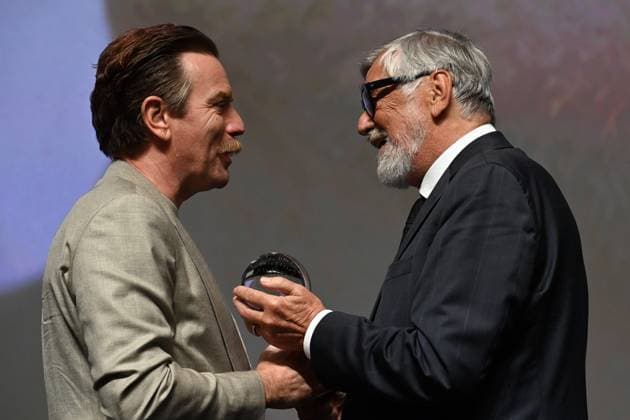 Scottish actor Ewan McGregor, left, received the Festival President’s Award from the President Jiri Bartoska, right, during the 57th Karlovy Vary International Film Festival (KVIFF), on July 1, 2023, at the Thermal Hotel in Karlovy Vary, Czech Republic. (CTKxPhoto SlavomirxKubes) CTKPhotoP2023070105794  CTKPhotoP2023070105794