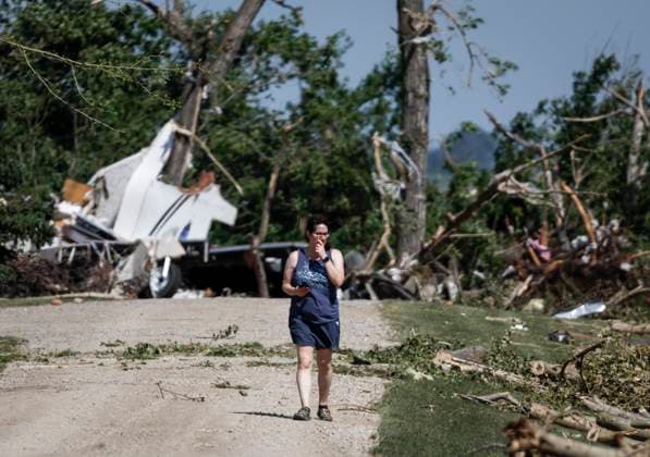 July 1, 2023, Carstairs, AB, CANADA: A woman looks for her belongings after a tornado damaged homes near Carstairs, Alta., Saturday, July 1, 2023. No injuries were reported. Carstairs CANADA  - ZUMAc35_ 20230701_zaf_c35_134 Copyright: xJeffxMcintoshx