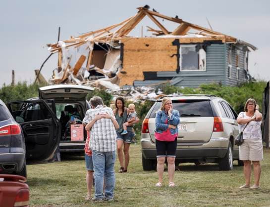 July 1, 2023, Carstairs, AB, CANADA: People embrace after a tornado damaged homes near Carstairs, Alta., Saturday, July 1, 2023. No injuries were reported. Carstairs CANADA  - ZUMAc35_ 20230701_zaf_c35_140 Copyright: xJeffxMcintoshx