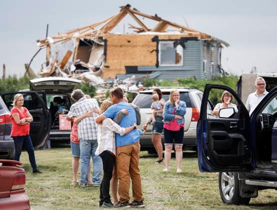 July 1, 2023, Carstairs, AB, CANADA: People embrace after a tornado damaged homes near Carstairs, Alta., Saturday, July 1, 2023. No injuries were reported. Carstairs CANADA  - ZUMAc35_ 20230701_zaf_c35_141 Copyright: xJeffxMcintoshx