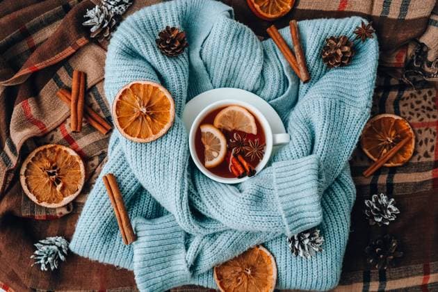 Blue sweater and cup of hot tea with lemon cinnamon sticks and anise star. Dry slices of citrus orange and cones. Hot winter cocktail. Christmas, Thanksgiving drinks. Autumn, grog, hot sangria, mulled wine Blue sweater and cup of hot tea with lemon cinnamon sticks and anise star. Dry slices of citrus orange and cones. Hot winter cocktail. Christmas, Thanksgiving drinks. Autumn, grog, hot sangria, mulled wine. Festive holiday flat lay atmosphere Copyright: xZoonar.com AnastasiiaxYanishevskax 18978481