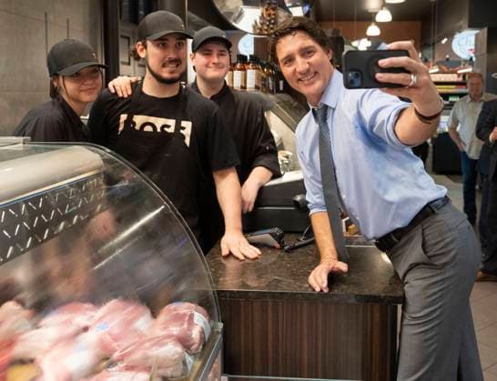 July 5, 2023, St.-Hyacinthe, PQ, Canada: Prime Minister Justin Trudeau takes a selfie with vendors while visiting a market in St.-Hyacinthe, Que., Wednesday, July 5, 2023. St.-Hyacinthe Canada  - ZUMAc35_ 20230705_zaf_c35_058 Copyright: xRyanxRemiorzx