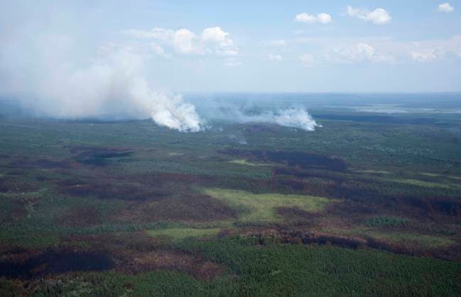 July 5, 2023, Lebel-sur-Quevillon, PQ, Canada: Smoke plumes are seen in the forest along with burnt areas near Lebel-sur-Quevillon, Que., Wednesday, July 5, 2023. Lebel-sur-Quevillon Canada  - ZUMAc35_ 20230705_zaf_c35_070 Copyright: xAdrianxWyldx