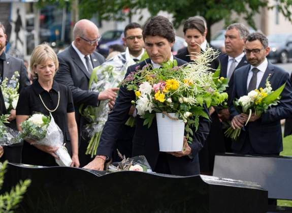 July 6, 2023, LAC MEGANTIC, PQ, CANADA: Prime Minister Justin Trudeau places flowers on a memorial following a commemorative mass to pay tribute to the 47 lives lost on the tenth anniversary of the 2013 rail disaster in Lac Megantic, Que. on Thursday, July 6, 2023. LAC MEGANTIC CANADA  - ZUMAc35_ 20230706_zaf_c35_029 Copyright: xChristinnexMuschix