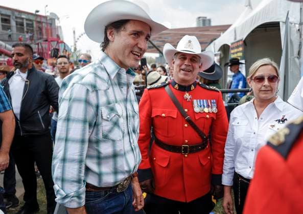 July 7, 2023, Calgary, AB, CANADA: Prime Minister Justin Trudeau, left, and RCMP Commissioner Mike Duheme walk the grounds of the Calgary Stampede in Calgary, Friday, July 7, 2023. Calgary CANADA  - ZUMAc35_ 20230707_zaf_c35_052 Copyright: xJeffxMcintoshx