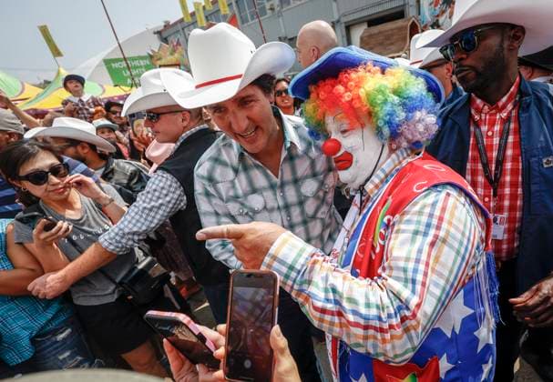 July 7, 2023, Calgary, AB, CANADA: Prime Minister Justin Trudeau, left, walks the grounds of the Calgary Stampede in Calgary, Friday, July 7, 2023. Calgary CANADA  - ZUMAc35_ 20230707_zaf_c35_054 Copyright: xJeffxMcintoshx