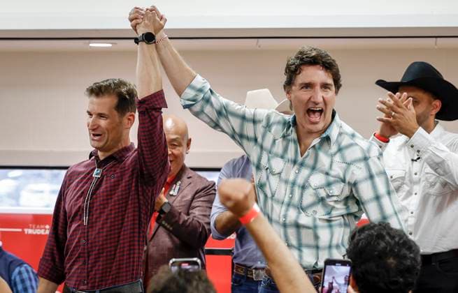 July 7, 2023, Calgary, AB, CANADA: Prime Minister Justin Trudeau, right, holds up the arm of by-election candidate Elliot Weinstein while attending a Liberal Party of Canada event in Calgary, Friday, July 7, 2023. Calgary CANADA  - ZUMAc35_ 20230707_zaf_c35_061 Copyright: xJeffxMcintoshx