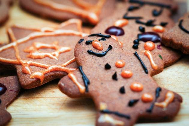 Children hand decorated gingerbread cookies Closeup on children hand decorated christmas gingerbread cookie man figurine Copyright: xZoonar.com ZWOLINSKIxJANx 15998937