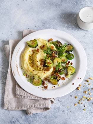 Brussels sprouts with pistachios, raisins and Skordalia (mashed potatoes). Healthy Meal preparation. Plant-based dishes. Green living. Vegan recipe. Food styling. Vegetarian cuisine Brussels sprouts with pistachios, raisins and Skordalia (mashed potatoes). Healthy Meal preparation. Plant-based dishes. Green living. Vegan recipe. Food styling. Vegetarian cuisine. Healthy eating Copyright: xZoonar.com NATALIIAxZHEKOVAx 17901558