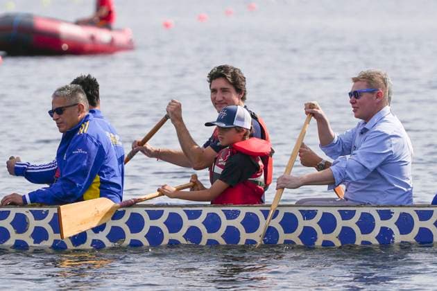 July 17, 2023, Halifax, NS, Canada: Prime Minister Justin Trudeau, centre, and his son Hadrien join chiefs and other dignitaries in paddling across Lake Banook prior to Canoe Kayak competition at the North American Indigenous Games 2023 in Halifax, Monday, July 17, 2023. Halifax Canada  - ZUMAc35_ 20230717_zaf_c35_071 Copyright: xDarrenxCalabresex
