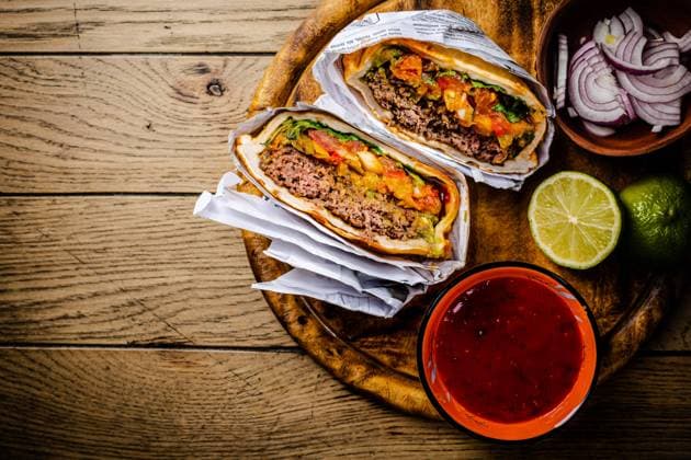 Hamburger or sandwich Hamburger or sandwich, beef torta with salsa dip and guacamole. Mexican cuisine. Copyright: xZoonar.com IngridxBalabanovax 20338229