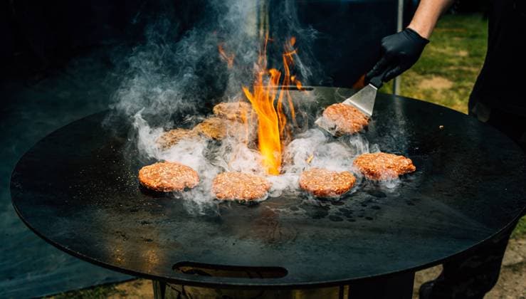 Preparing juicy beef hamburger patties . BBQ meat sizzling over hot flames. Preparing juicy beef hamburger patties . BBQ meat sizzling over hot flames. Copyright: xZoonar.com IngridxBalabanovax 20338235