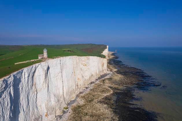 View from drone of Belle Tout lighthouse at low tide, Seven Sisters chalk cliffs, South Downs National Park, East Sussex, England, United Kingdom, Europe Copyright: PaoloxGraziosi 1361-159