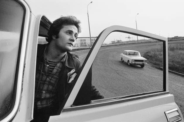 Moscow, USSR. Moskvich car test driver Sergei Kolin drives around the Moskvich Production Association Leninsky Komsomol Car Plant. The exact date of the photograph is unknown.  18298755