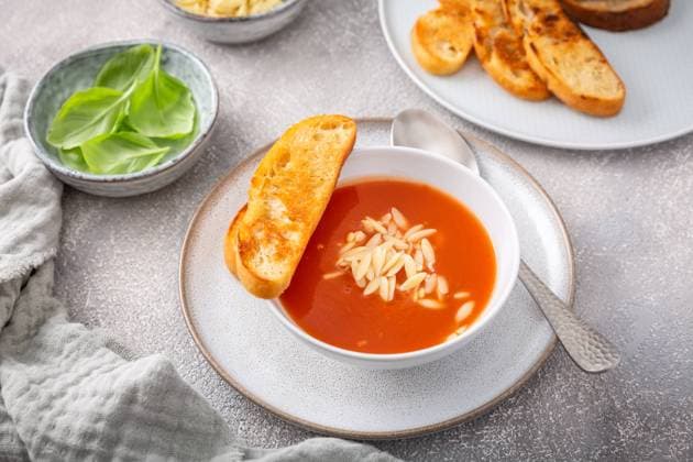 Greek tomato soup with orzo pasta and ciabatta bread Greek tomato soup with orzo pasta and ciabatta bread Copyright: xZoonar.com IngridxBalabanovax 20421912