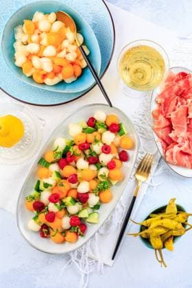 Summer light food. Cucumber and melon salad with raspberries and Prosciutto and pickled hot peppers Summer light food. Cucumber and melon salad with raspberries and Prosciutto and pickled hot peppers Copyright: xZoonar.com IngridxBalabanovax 20436674
