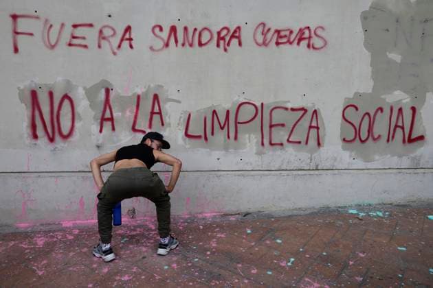 Protest Against Mayor Sandra Cuevas For Social Cleansing Actions In Mexico City A protester dances in front of a wall painted by several people to avoid being restored by authorities while other people demonstrate in the esplanade of the Cuauhtemoc mayor s office in Mexico City, against what they define as social cleansing , ordered through the diamond operation by Mayor Sandra Cuevas, after the implementation of operations that seek order, tranquility and cleanliness of the streets of the district, according to the district. Mexico City Mexico City Mexico  Copyright: xGerardoxVieyrax originalFilename: vieyra-notitle230721_npVWR.jpg