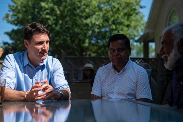 July 22, 2023, Scarborough, ONT, CANADA: Prime Minster Justin Trudeau and MP Gary Anandasangaree, right, speak with a family in Scarborough, Ont., to commemorate the 40th anniversary of Black July on Saturday, July 22, 2023. Scarborough CANADA  - ZUMAc35_ 20230722_zaf_c35_014 Copyright: xTijanaxMartinx