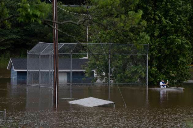 July 22, 2023, Halifax, NS, Canada: A man paddles a kayak through floodwater at a baseball diamond following a major rain event in Halifax on Saturday, July 22, 2023. A long procession of intense thunderstorms have dumped record amounts of rain across a wide swath of Nova Scotia, causing flash flooding, road washouts and power outages. Halifax Canada  - ZUMAc35_ 20230722_zaf_c35_021 Copyright: xDarrenxCalabresex