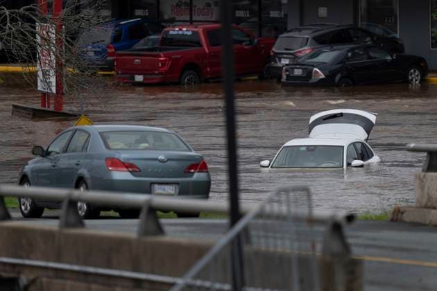 July 22, 2023, Halifax, NS, Canada: Abandoned cars in a mall parking lot are seen in floodwater following a major rain event in Halifax on Saturday, July 22, 2023. Halifax Canada  - ZUMAc35_ 20230722_zaf_c35_030 Copyright: xDarrenxCalabresex